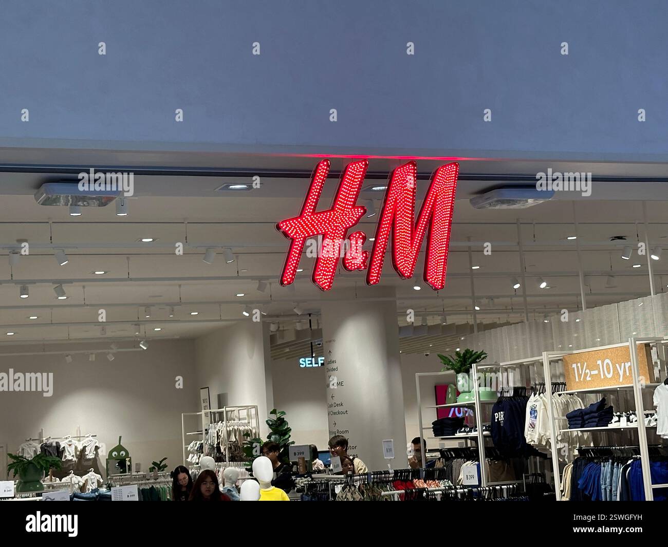 Bangkok, Thailand - Jan 2 2024. H&M store. - Smartphone Captured Stock Image Bangkok, Thailand - Jan 2 2024. H&M store. - Smartphone Captured Stock Image
