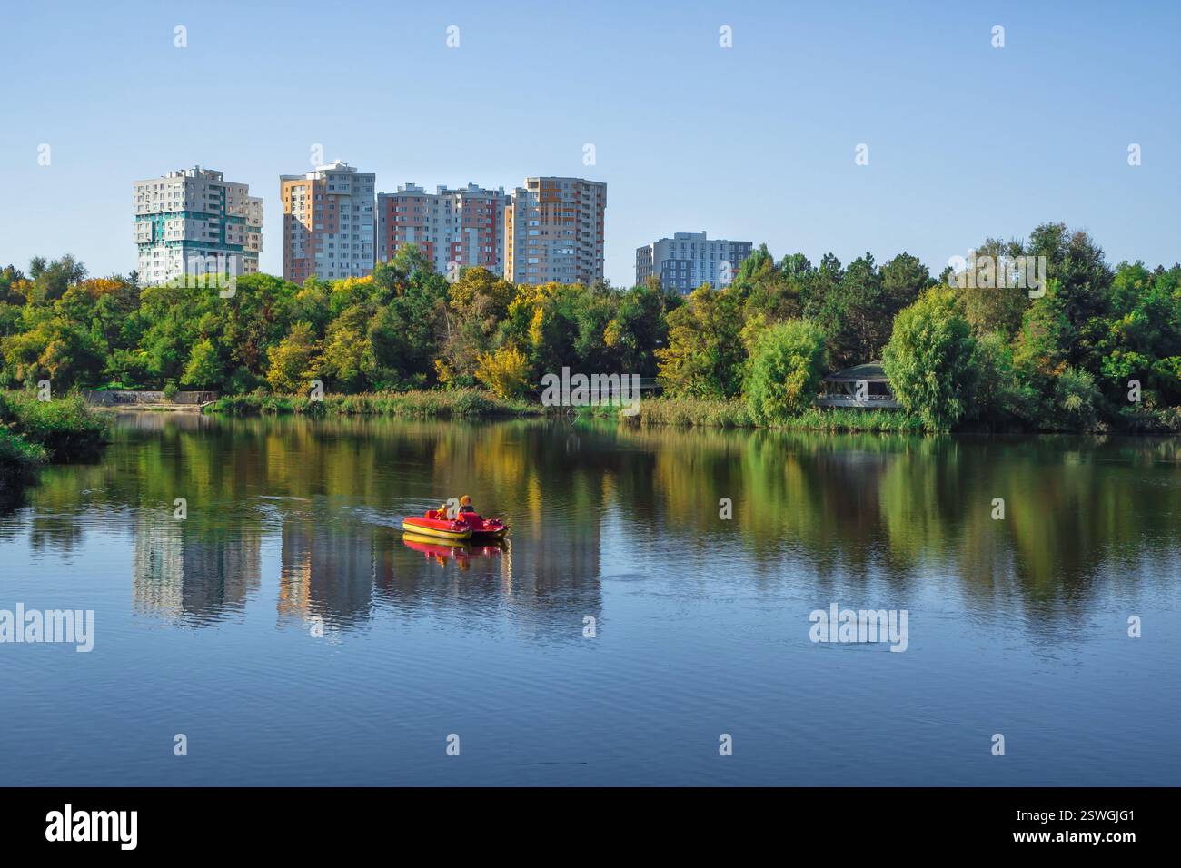 Eco-friendly housing in a Park area. Buildings near the lake Stock ... - Eco Friendly Retirement Communities For Sale