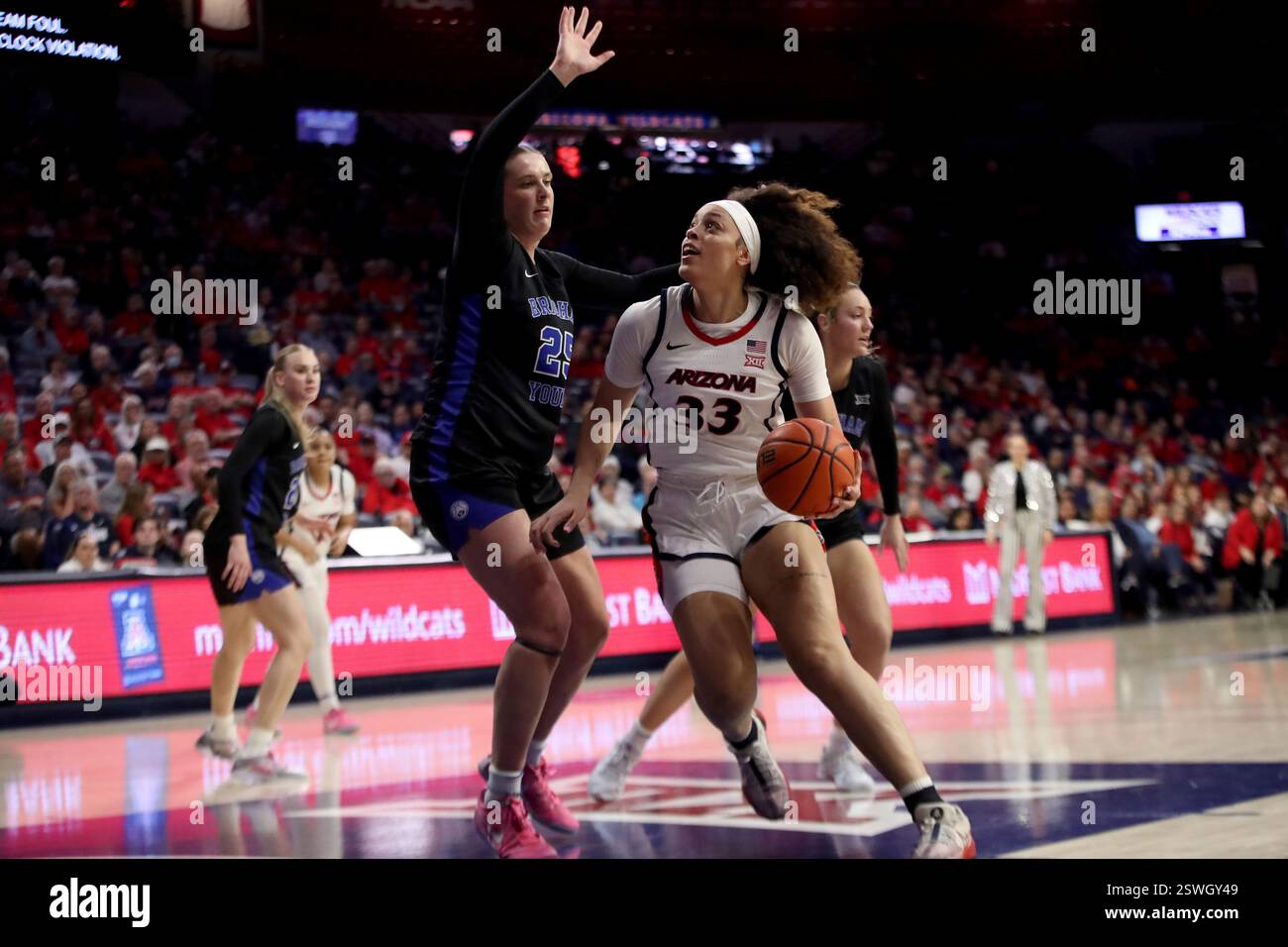 TUCSON, AZ - FEBRUARY 19: BYU Cougars forward Emma Calvert #25 guards ...
