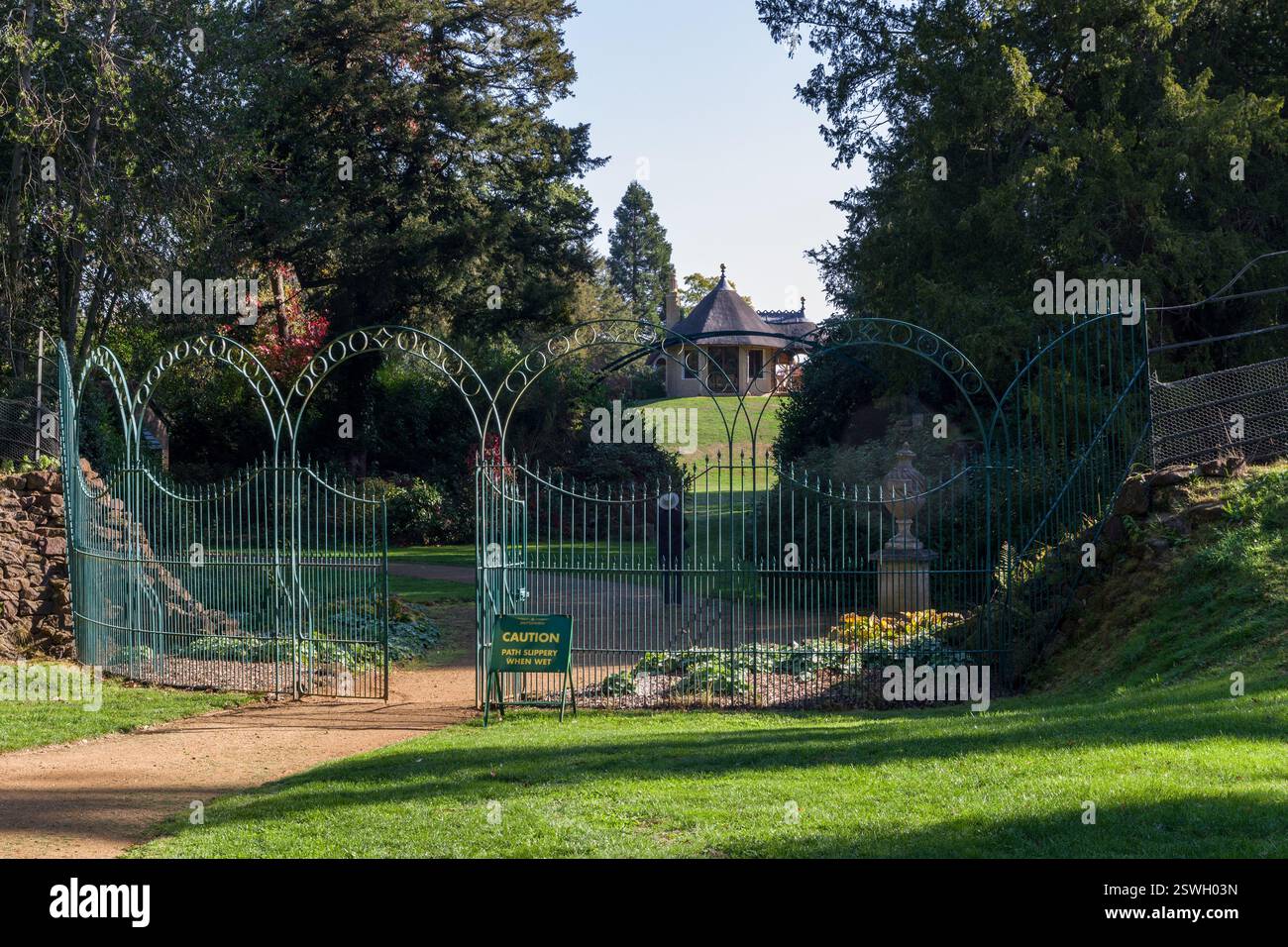 Ornate green metal gates at the rear entrance to the Swiss Garden, Old Warden, Bedfordshire, UK Stock Photo