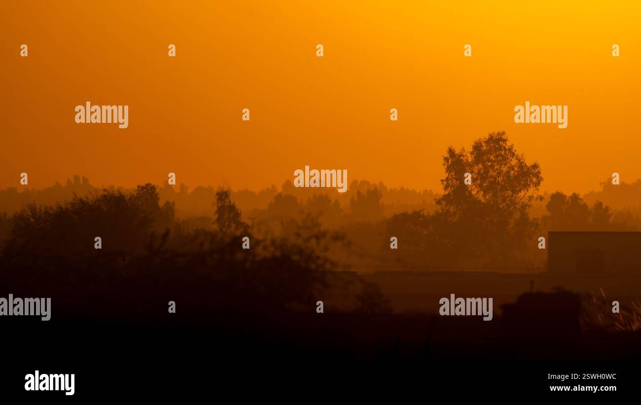 Clouds paint a dreamy sunset over the horizon Stock Photo - Alamy