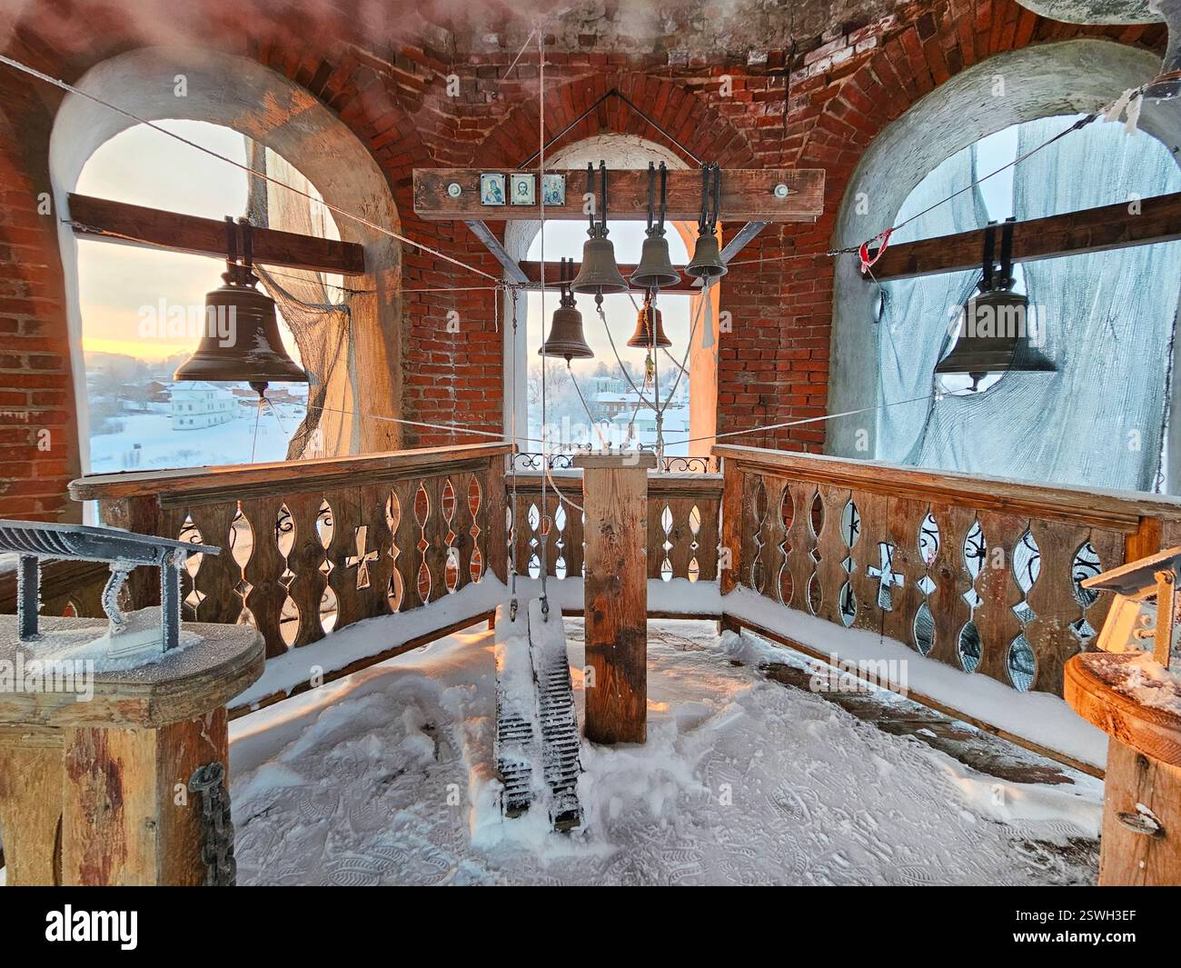 Church bells tower in sunny frosty winter day. Perm region, Russia. Stock Photo