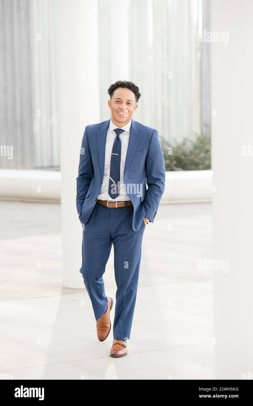 Professional walking towards the camera in suit Stock Photo