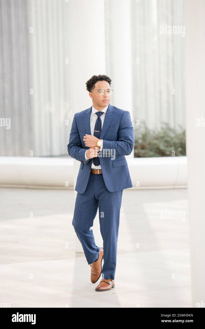 Professional business man walking in a suit Stock Photo