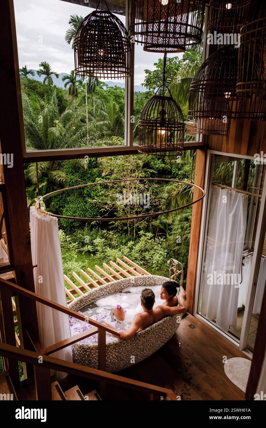 Relaxing retreat in a luxurious bath with nature views and a serene atmosphere in the jungle Stock Photo