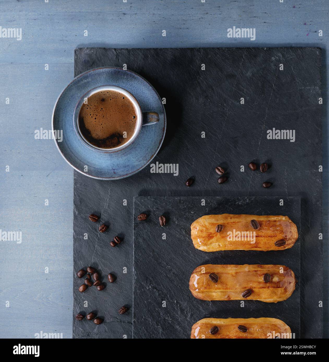 Coffe eclairs with cup of coffee Stock Photo