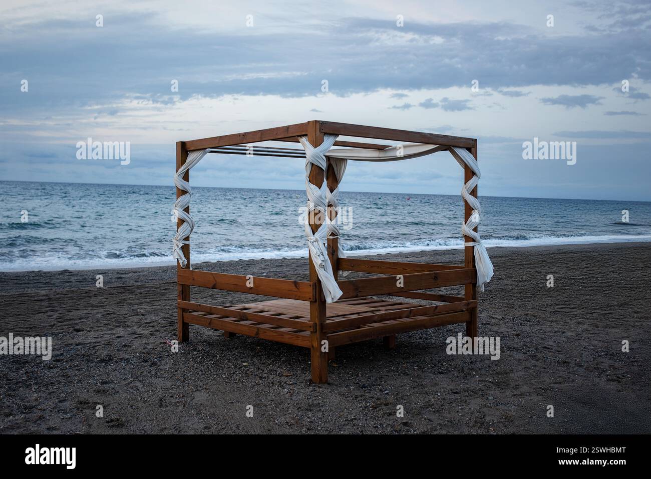 Wooden gazebo on the beach by the sea at sunset Stock Photo Alamy — free download