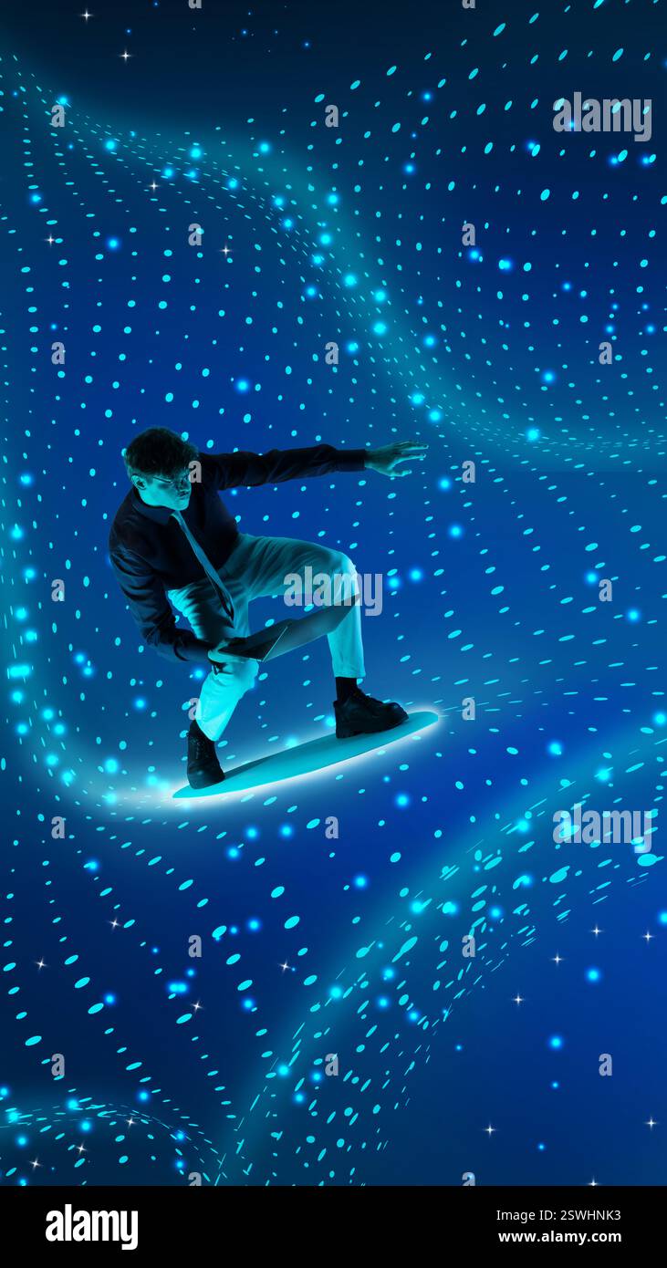 Man balancing on holographic blue data stream while using laptop ...