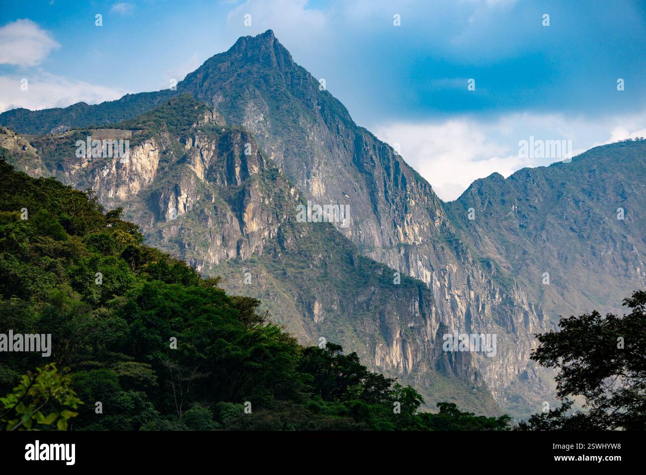 Unforgettable view of Machu Picchu nestled in the Andes mountains of ...