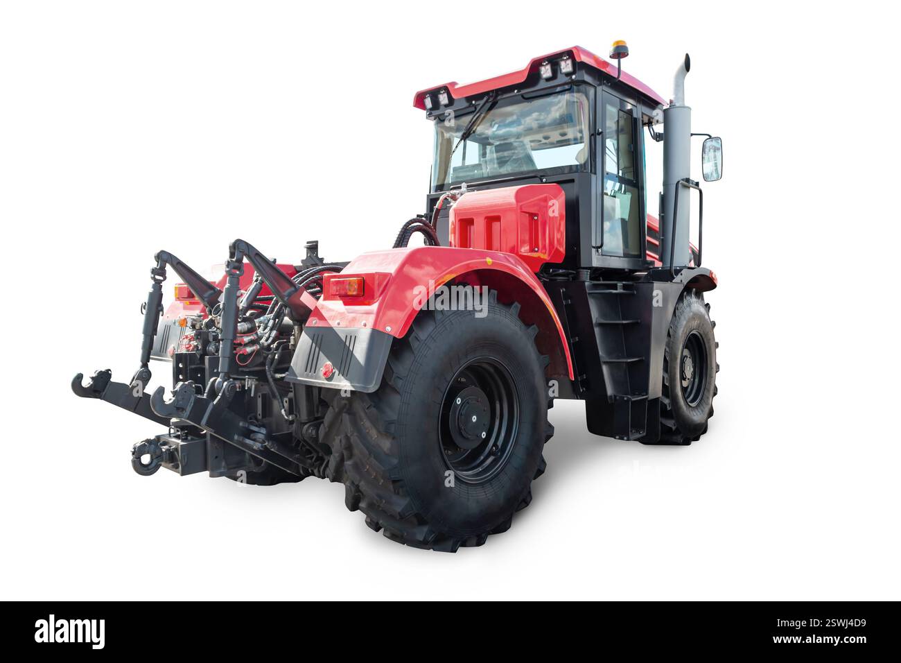 Red heavy wheeled tractor isolated on white background Stock Photo - Alamy