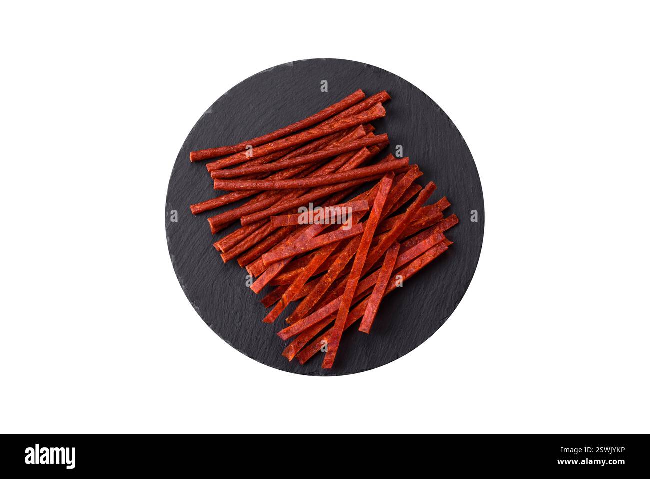 Jerky dried fish sticks with salt and spices on a white background Stock Photo