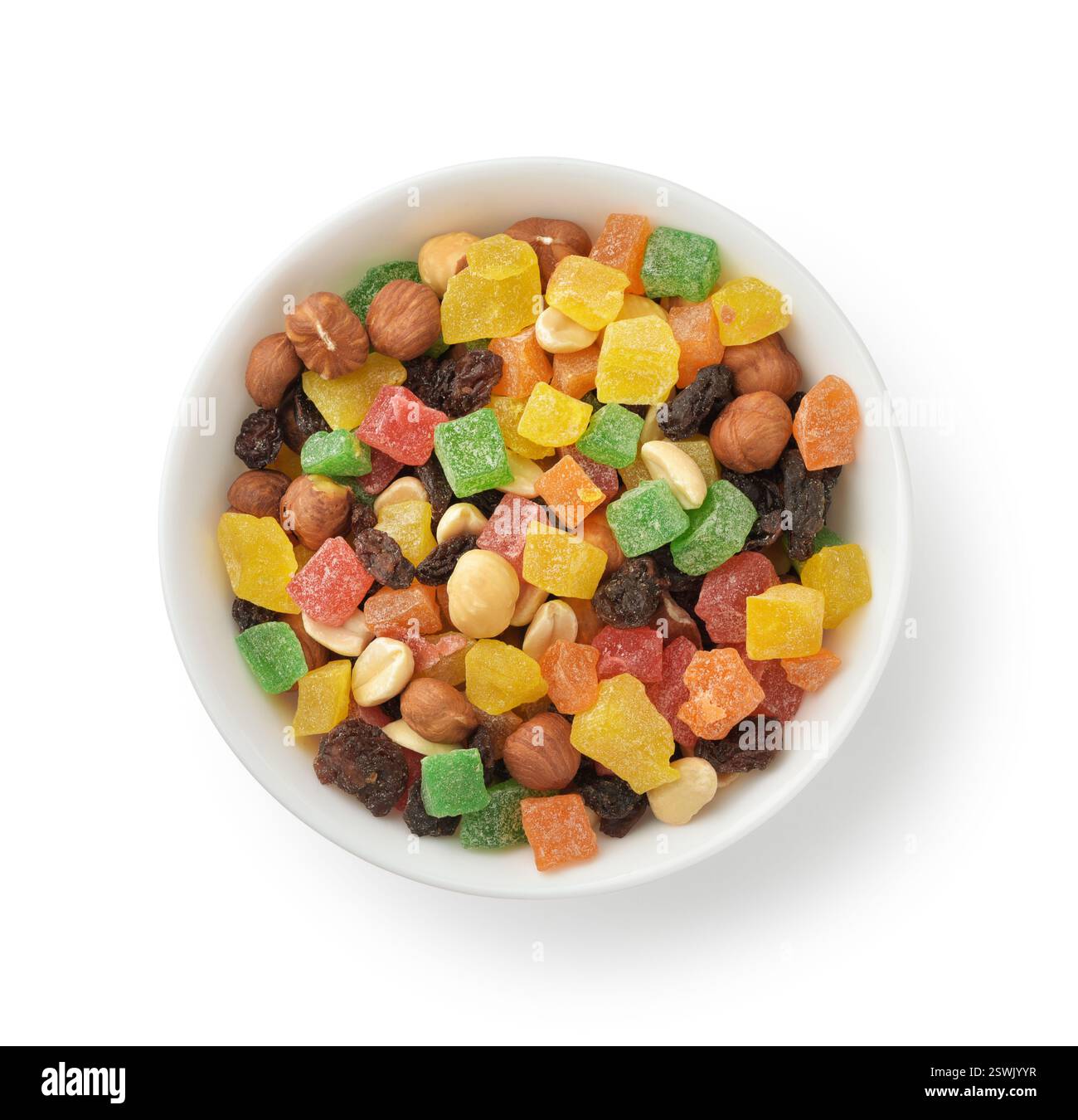 Top view of mixed candied fruit nuts in ceramic bowl isolated on white