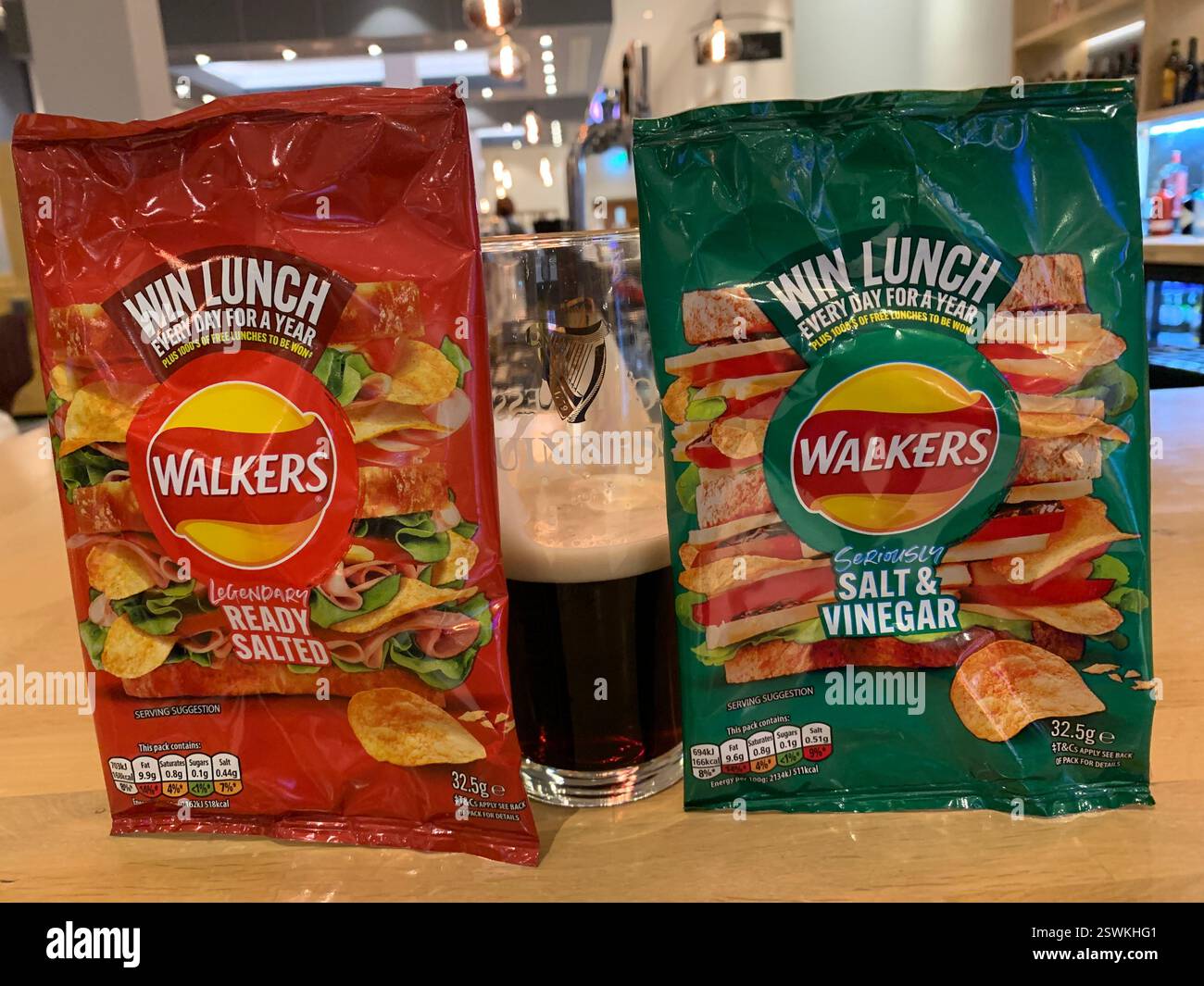 Walkers crip packet packets Salt and Vinegar ready salted plain win lunch plastic rapper bag food eat eating shiny potatoes potato marked food tasty - Smartphone Captured Stock Image