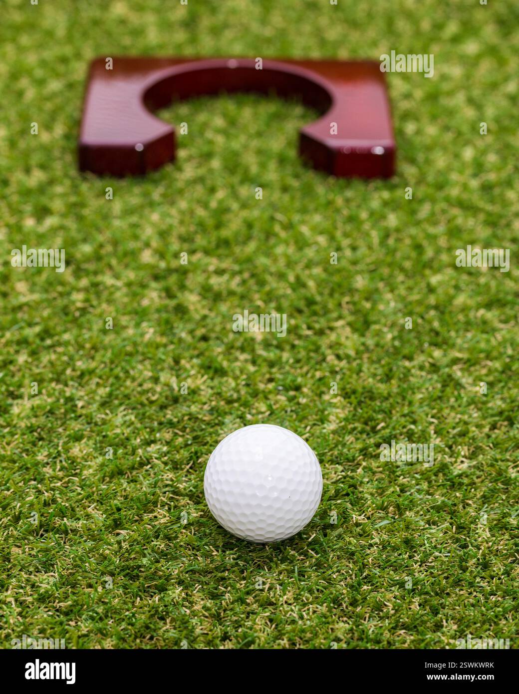Indoor mini golf equipment set on green grass background Stock Photo