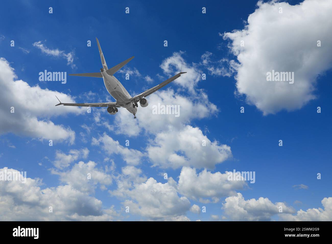 Airplane flying in beautiful blue sky with clouds Stock Photo - Alamy