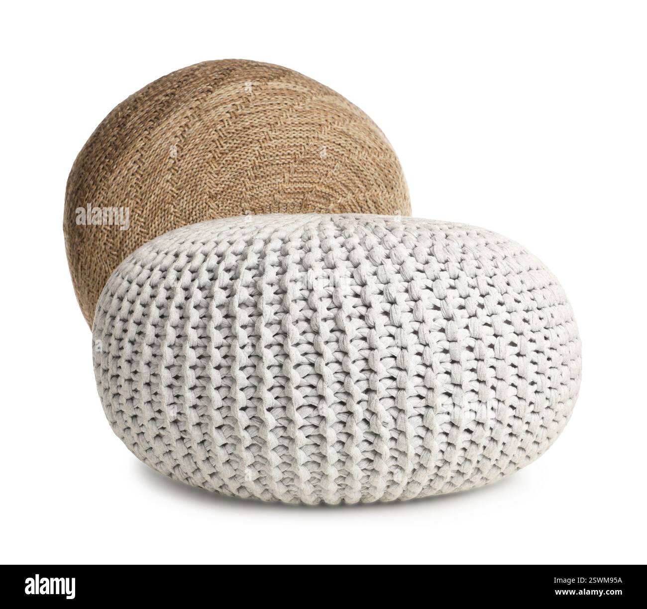 Different stylish knitted poufs on white background Stock Photo