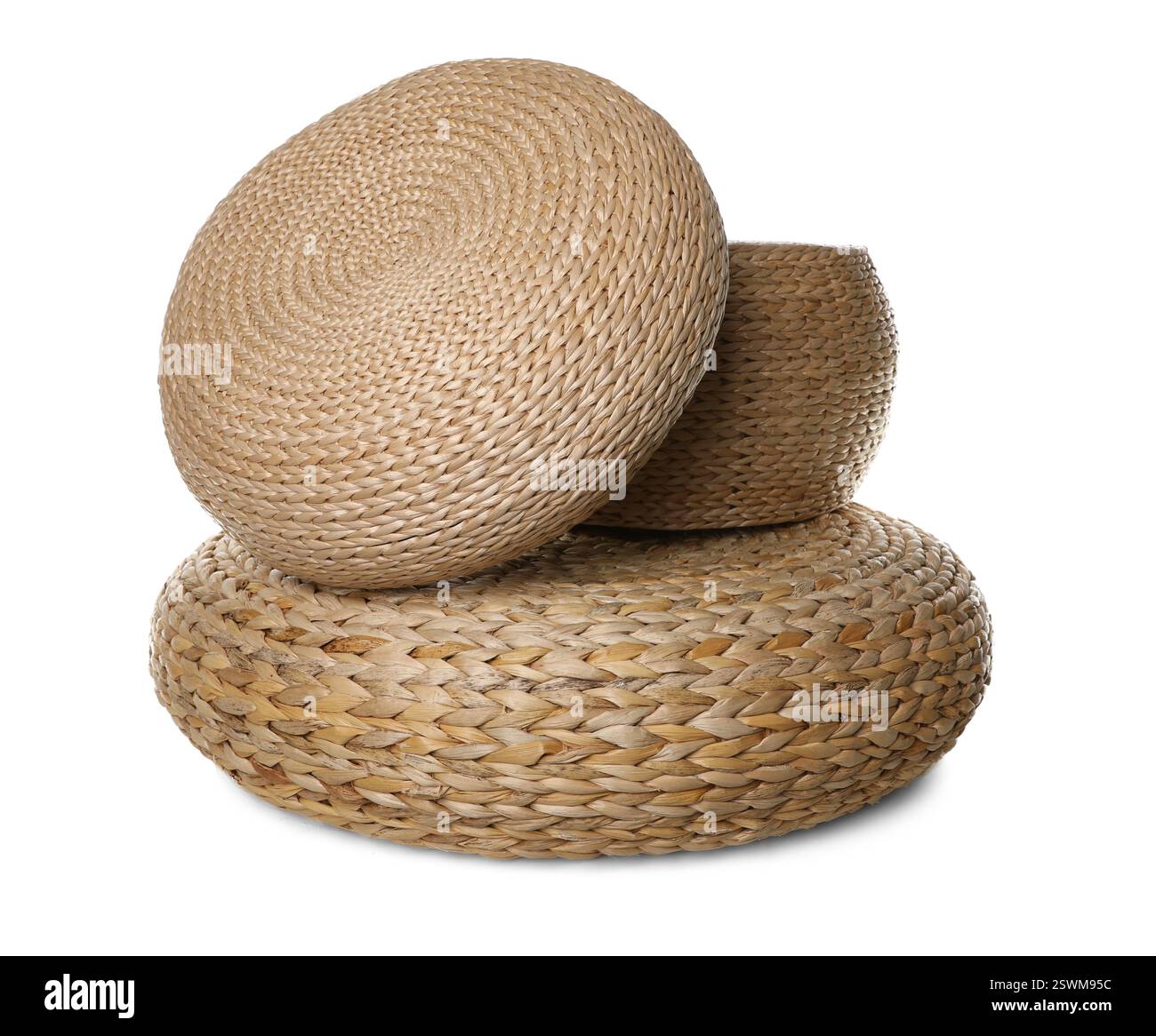 Three stylish wicker poufs on white background Stock Photo