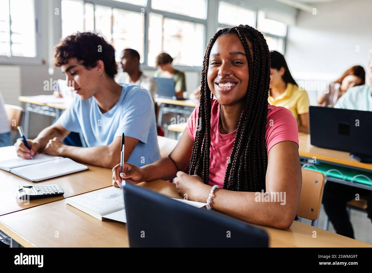 Diverse young high school students studying in classroom Stock Photo ...