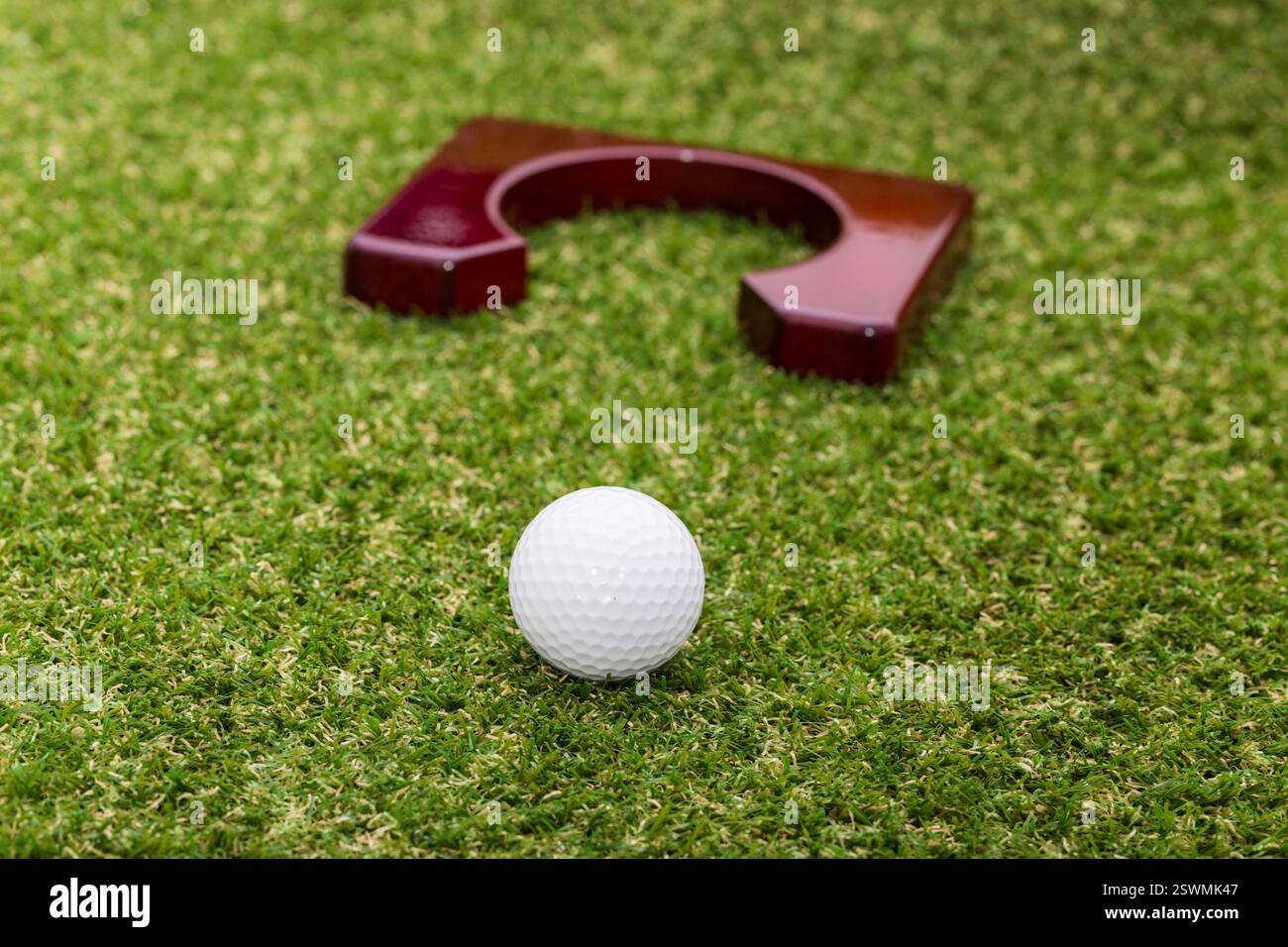 Indoor mini golf equipment set on green grass background Stock Photo