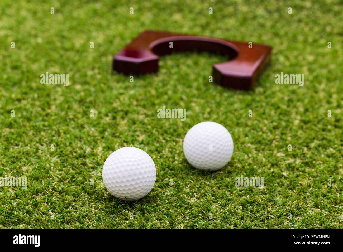 Indoor mini golf equipment set on green grass background Stock Photo