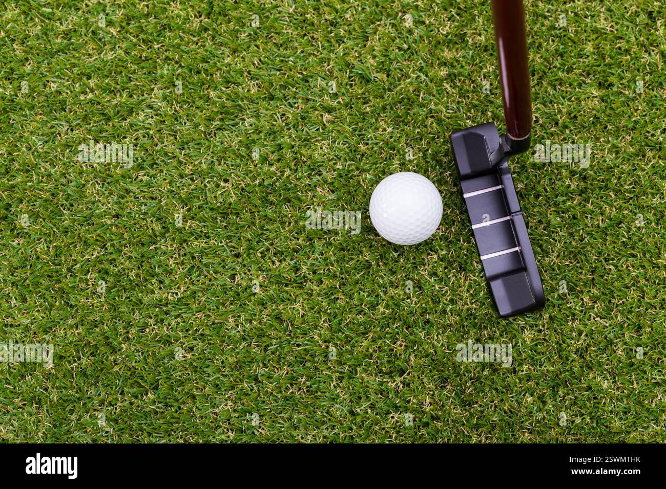 Indoor mini golf equipment set on green grass background Stock Photo