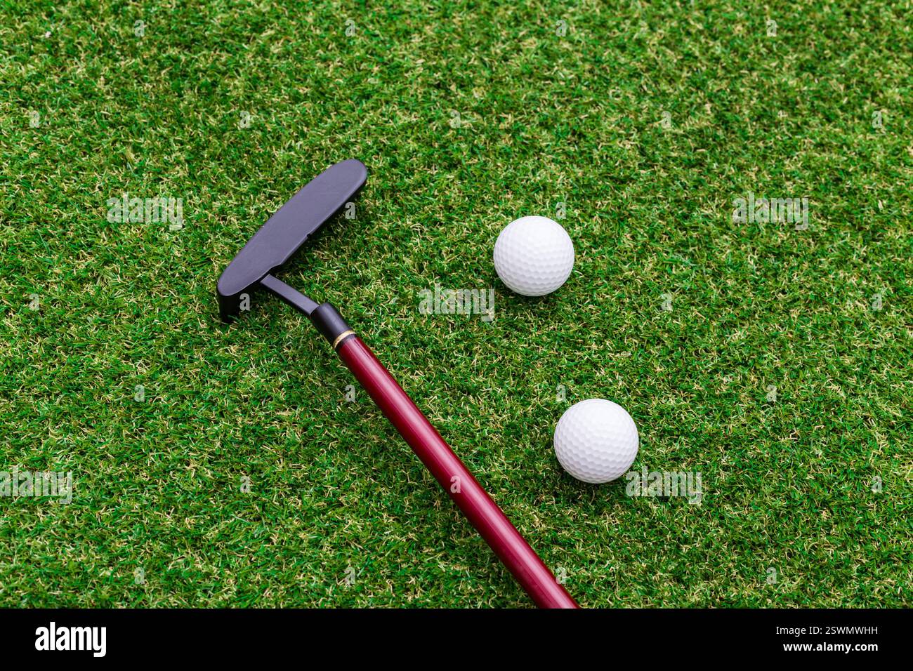 Indoor mini golf equipment set on green grass background Stock Photo