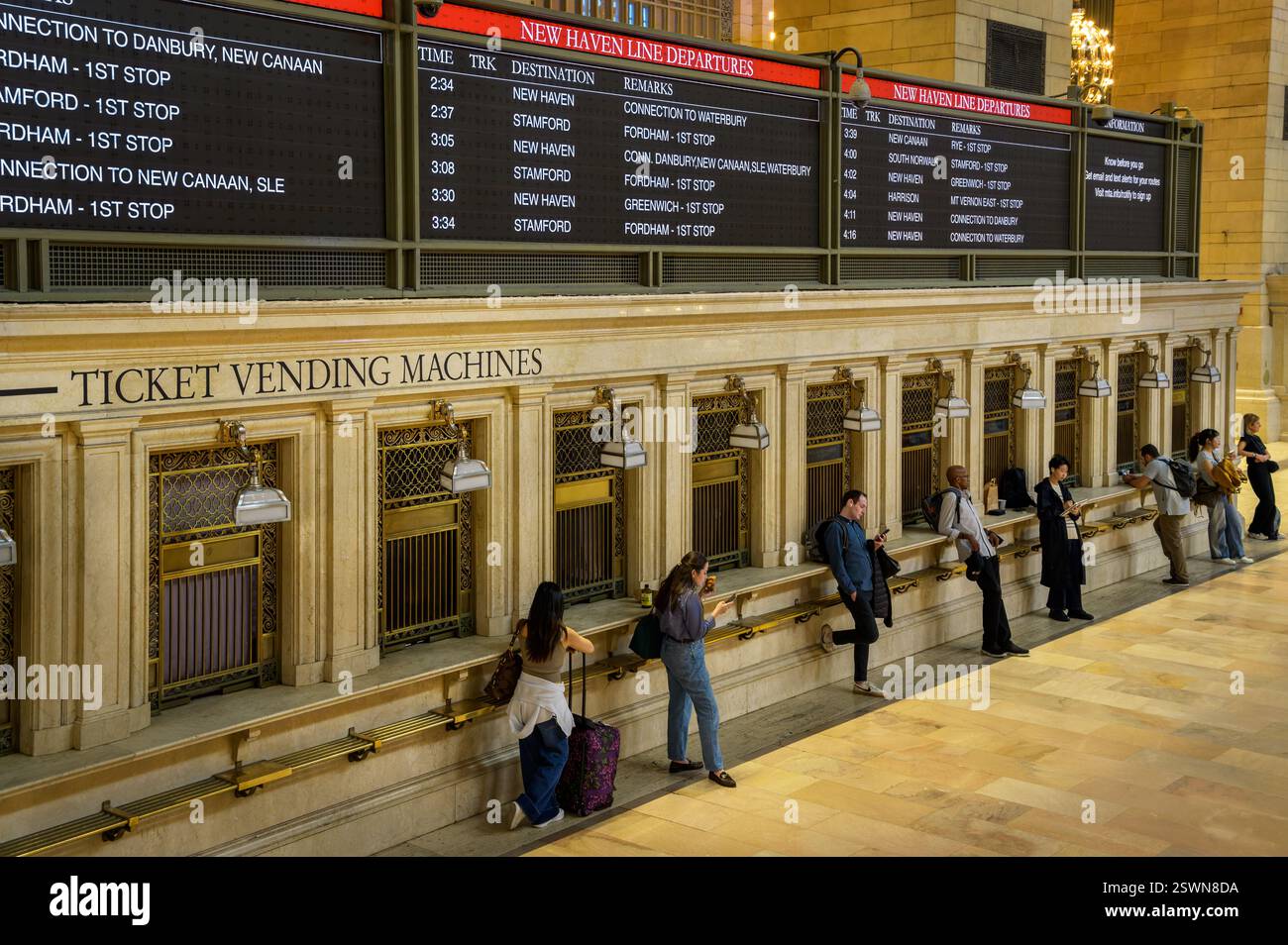 Commuters waiting ticket vending hi-res stock photography and images ...