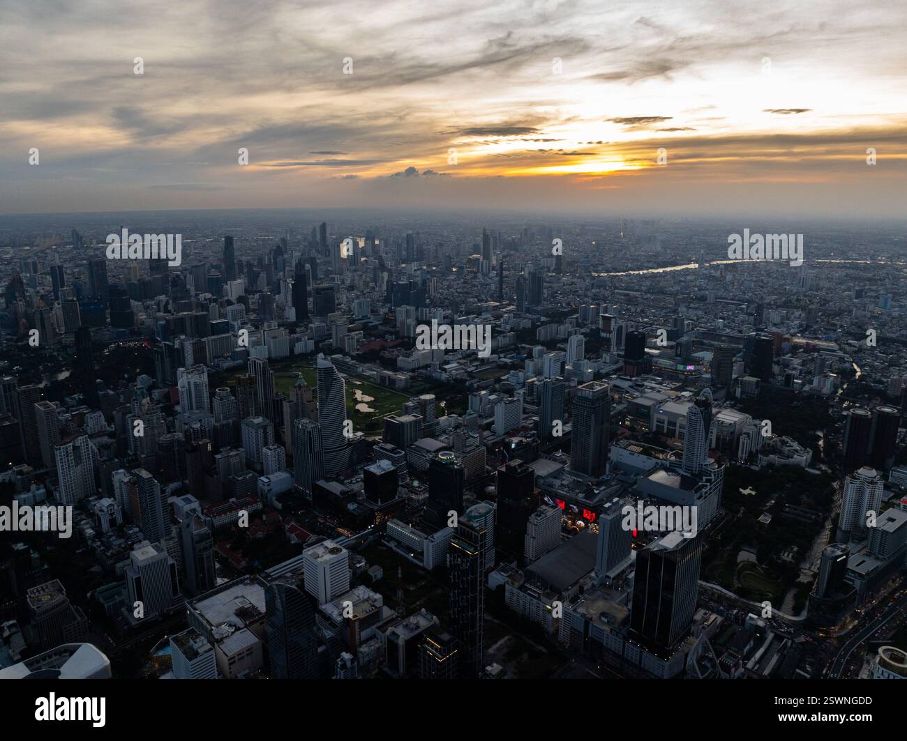 Evening view of Bangkok skyline under the sunset, high rise buildings ...