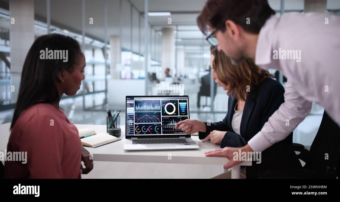 Diverse Team Analyzing Customer Data On Virtual Analytics Dashboard  Financial Analysts Collaborating On Predictive Analytics Stock Photo