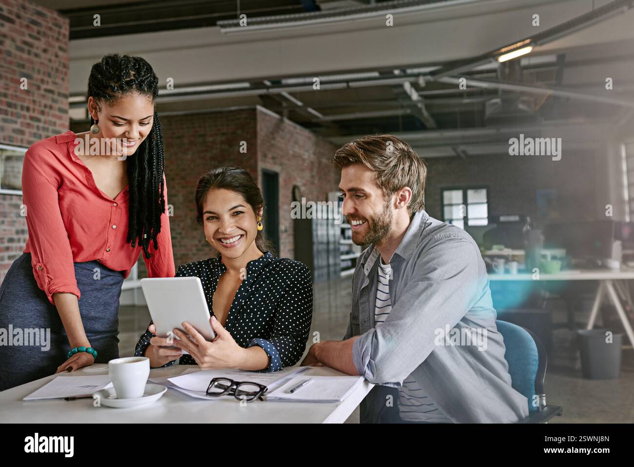 App developer, happy or people on tablet for teamwork, homepage layout or web research. Startup, designers or creative strategist in small business Stock Photo
