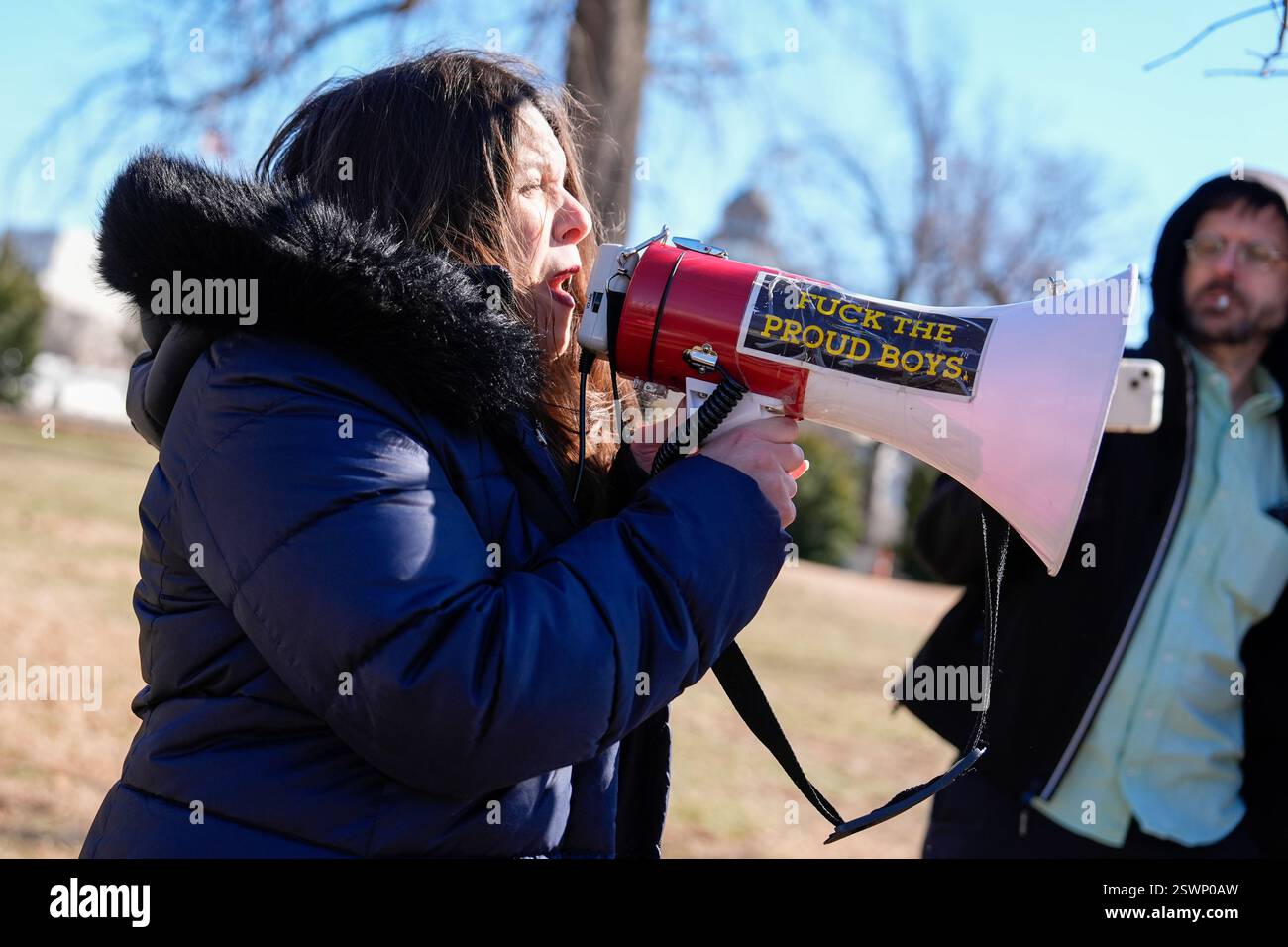 Washington, United States. 21st Feb, 2025. A protester speaks through a ...