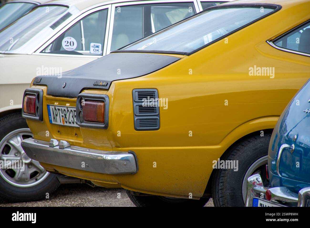 corfu, corfu, Greece. February 16, 2025: Yellow Toyota Corolla parked among other vintage cars. Stock Photo