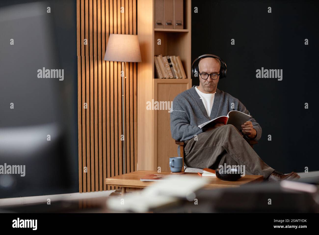Wide angle shot of concentrated middle aged man with shaved head ...