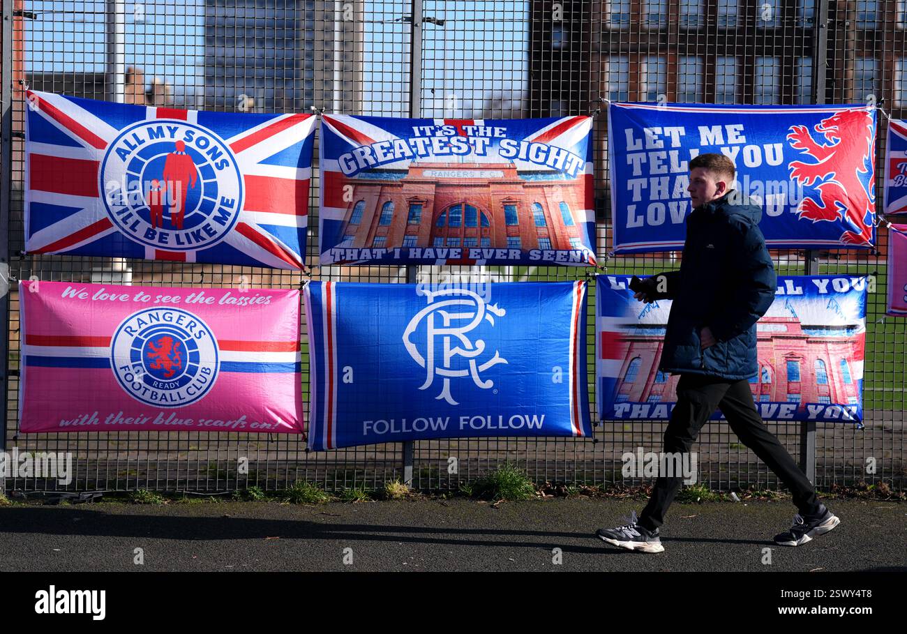 A fan walks past Rangers banners ahead of the William Hill Premiership ...