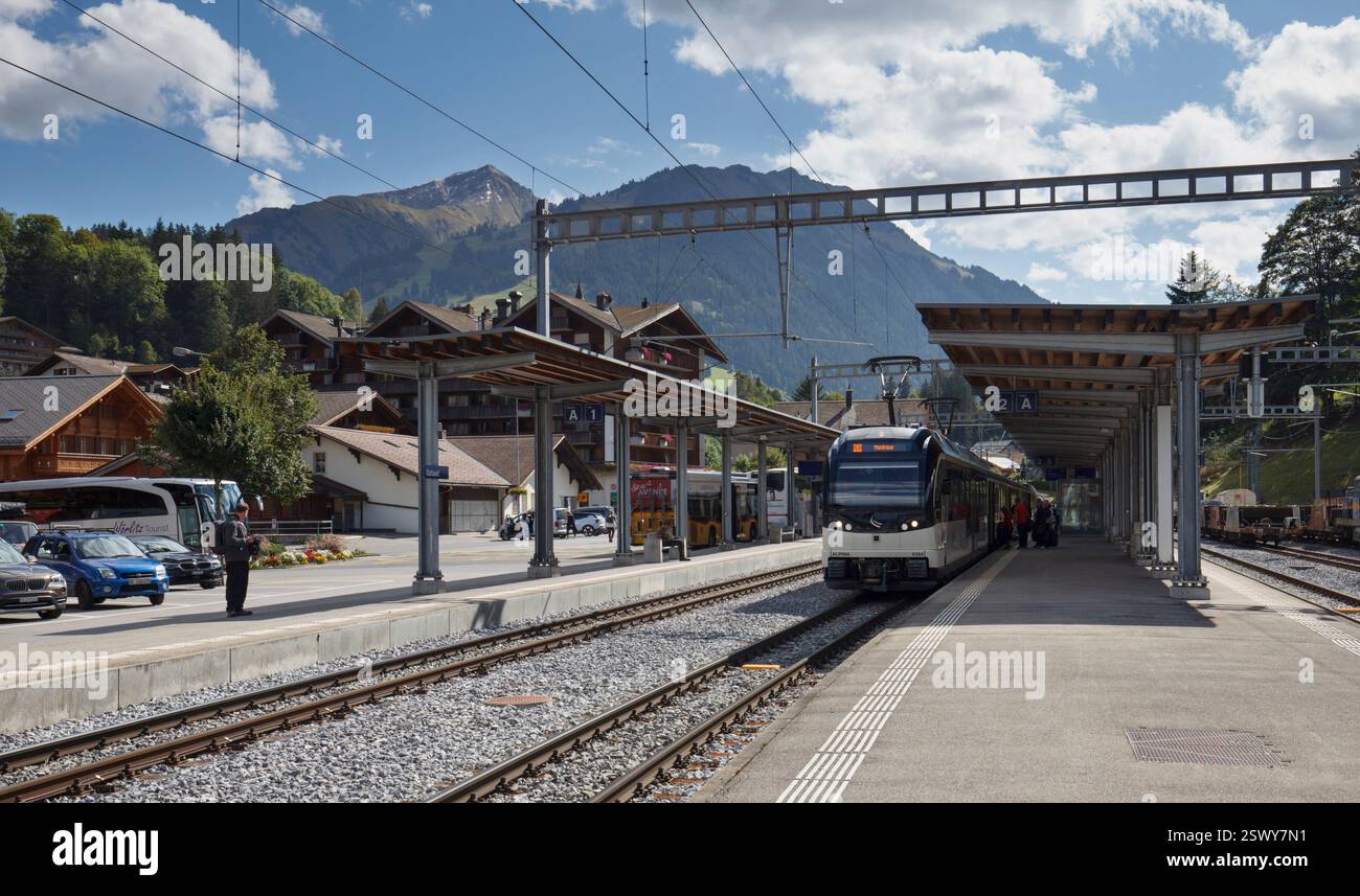 Train at Gstaad railway station (Switzerland) on the Golden Pass ...