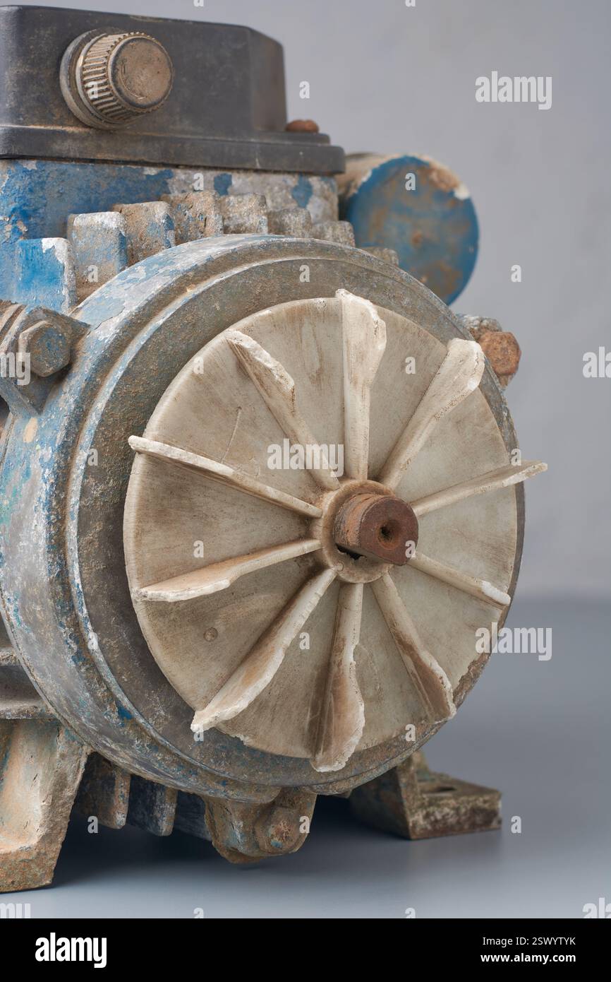 close-up of cooling fan with plastic blades attached to old rusty water ...