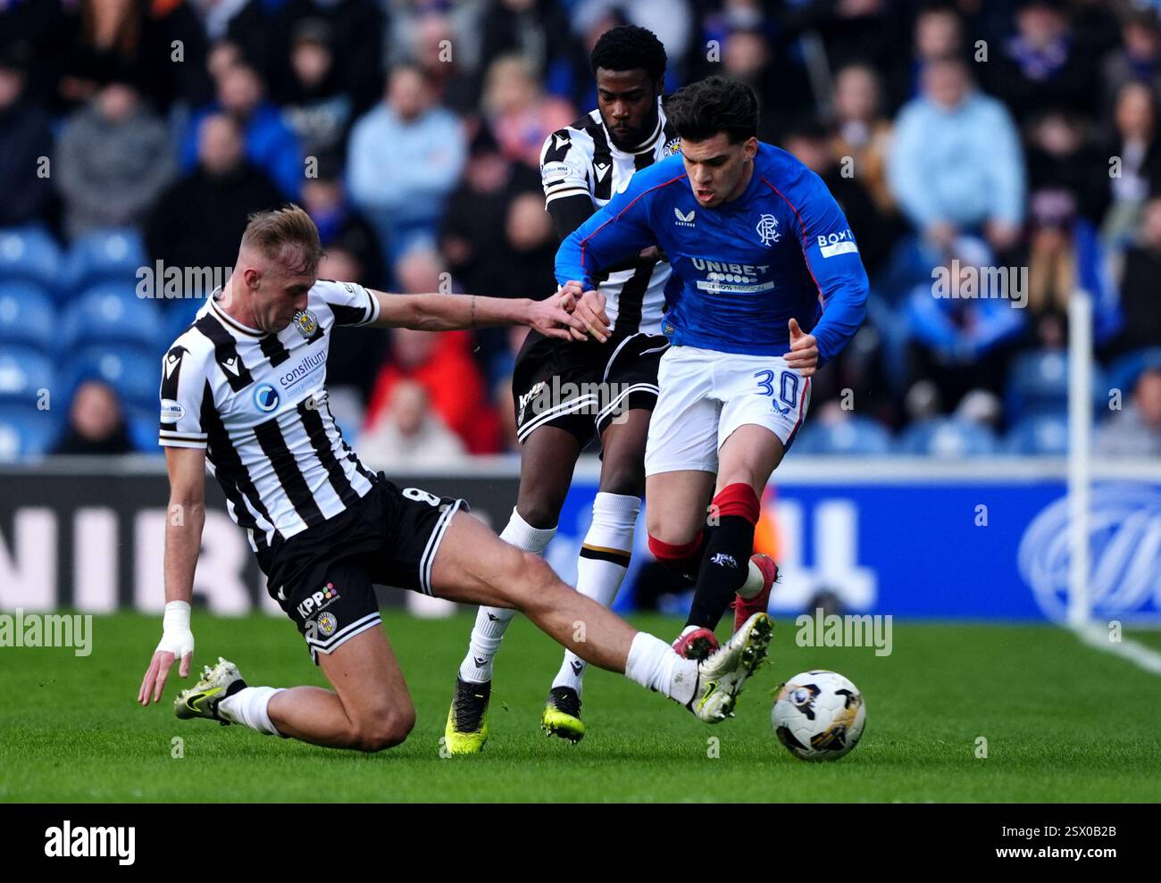 St Mirren's Killian Phillips challenges Rangers' Ianis Hagi (right ...