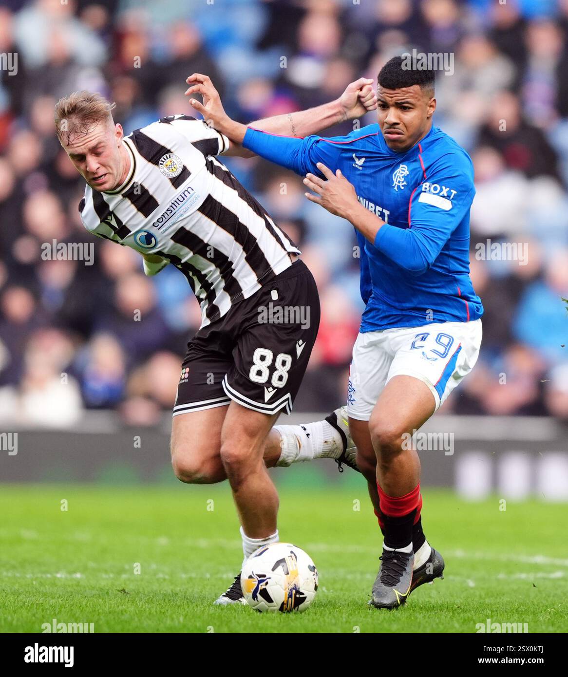Rangers' Hamza Igamane and St Mirren's Killian Phillips battle for the ...