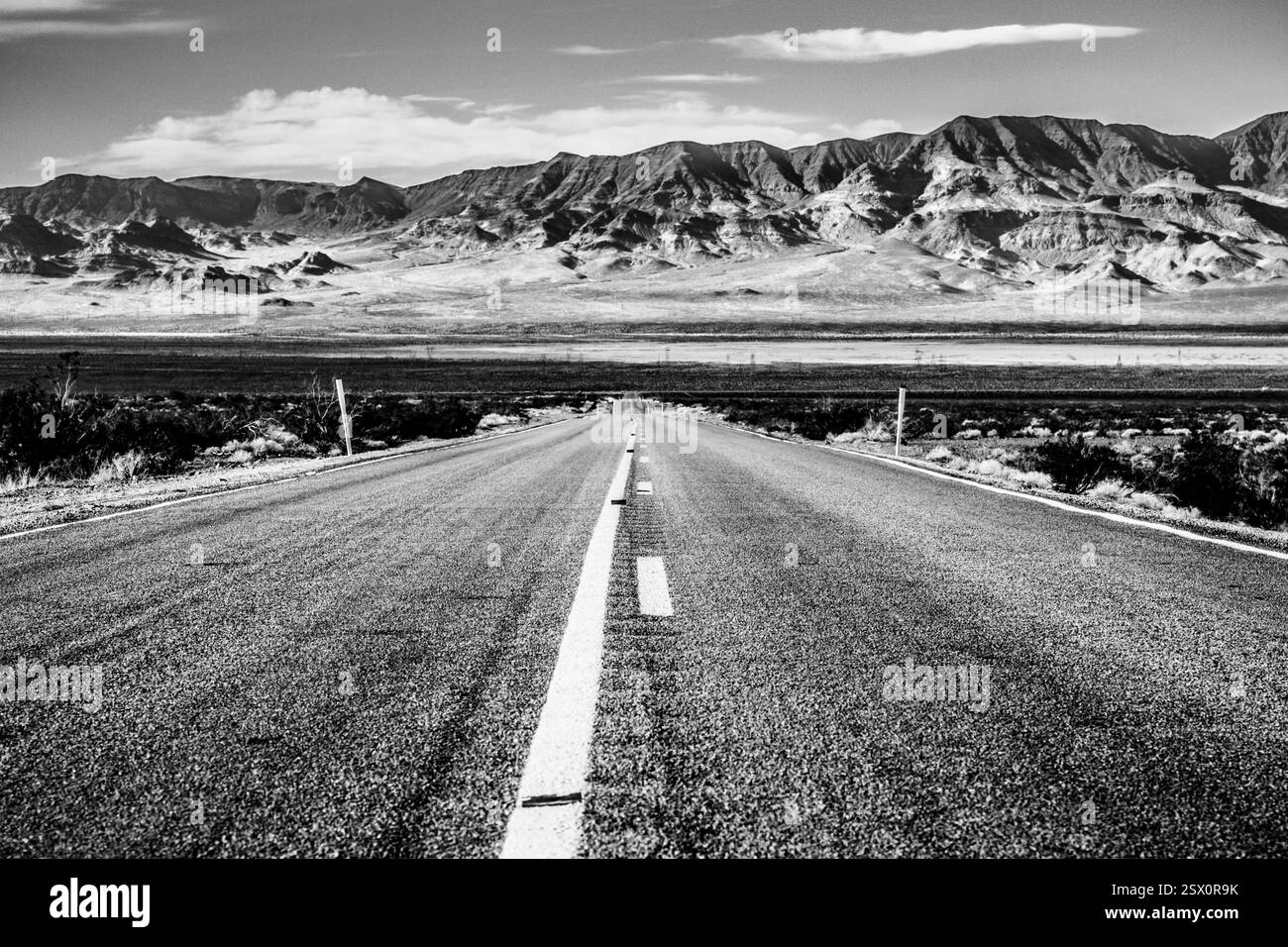 Road with a mountain in the background. The road is empty. There are no cars on the road Stock Photo