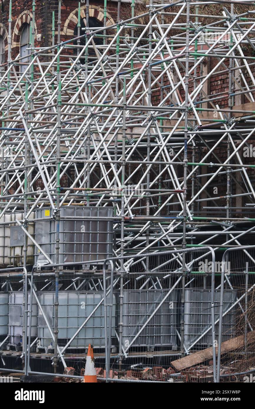 Scaffolding surrounding residential development for safe access to ...