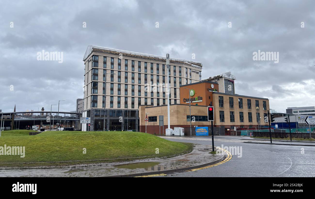 Glasgow city centre views of iconic buildings and famous tourist attractions in the rain. Dull overcast day. Grim Scottish city - Smartphone Captured Stock Image