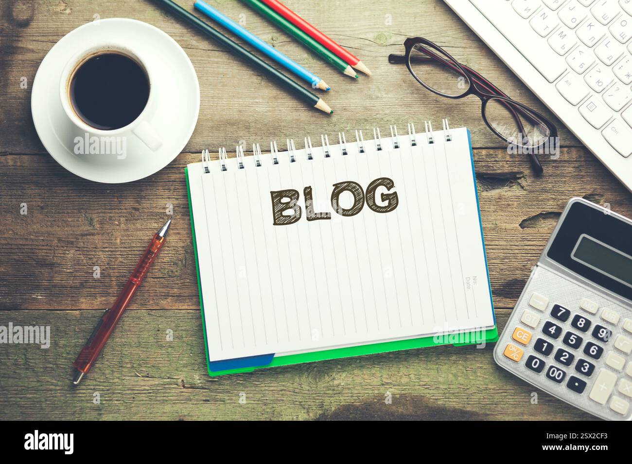 blog word on notepad and keyboard on desktop Stock Photo