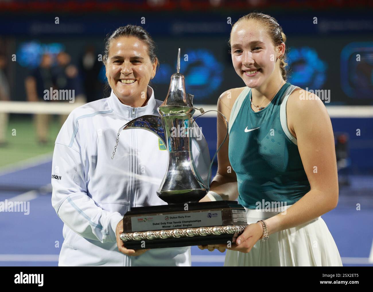 Dubai, UAE, 22nd. Feb, 2025. Tennis player  Mirra Andreeva and her coach Conchita Martinez with the trophy at the Dubai Duty Free Tennis  Championships tournament at  Dubai Duty Free Tennis Stadium on Saturday 22 February 2025.,  © Juergen Hasenkopf / Alamy Live News Stock Photo