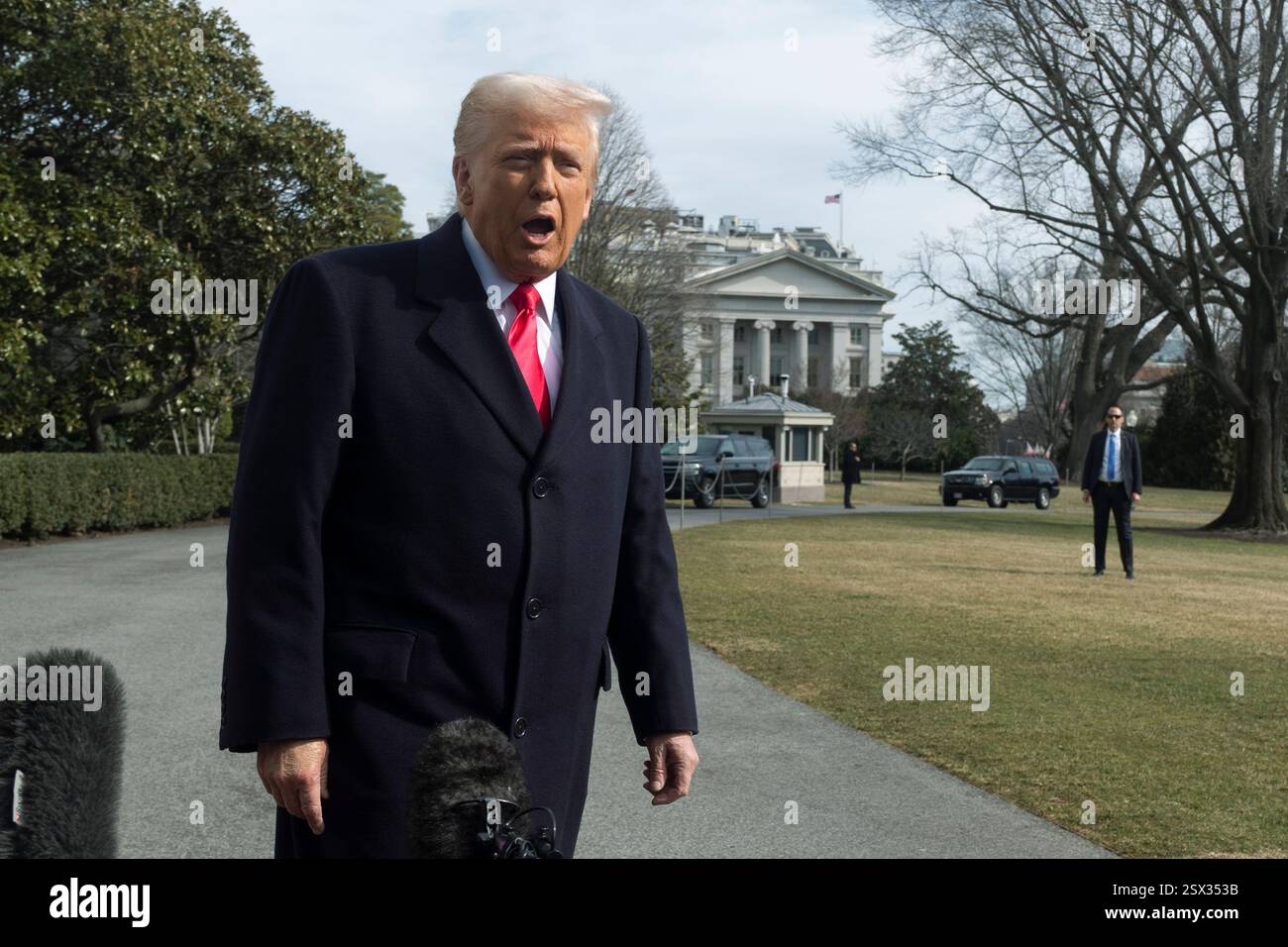 President Donald Trump speaks to reporters before leaving the White ...