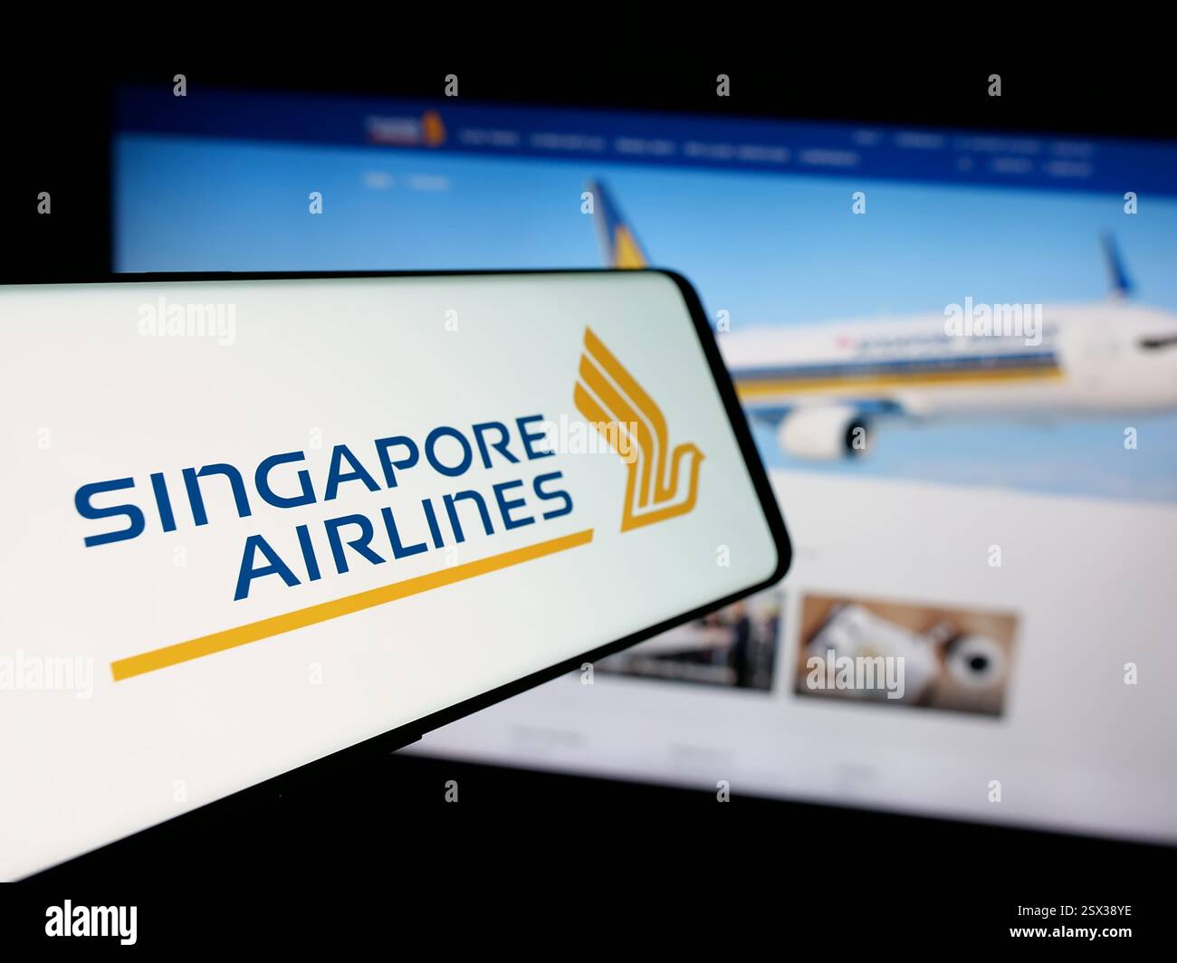 Germany. 17th Jan, 2025. In this photo illustration, a smartphone with the logo of airline company Singapore Airlines Limited is seen on screen in front of business website. (Credit Image: © Timon Schneider/SOPA Images via ZUMA Press Wire) EDITORIAL USAGE ONLY! Not for Commercial USAGE! Stock Photo