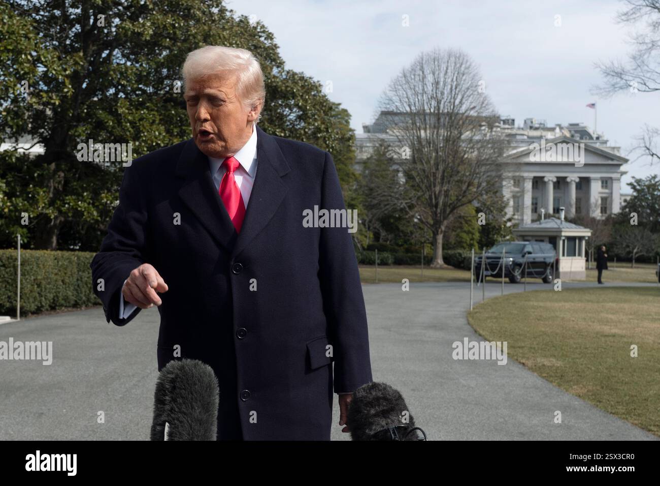 President Donald Trump speaks to reporters before leaving the White ...