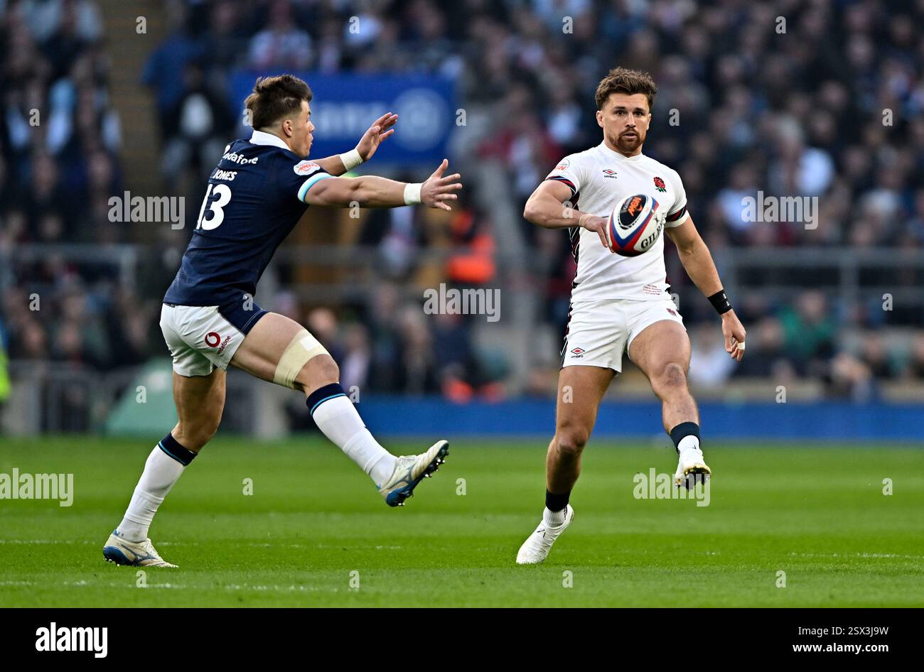 Twickenham, United Kingdom. 22nd Feb, 2025. Guinness Mens 6 Nations. England V Scotland. Allianz Stadium. Twickenham. Henry Slade (England) kicks past Huw Jones (Scotland) during the England V Scotland Guinness Mens 6 Nations rugby match at the Allianz Stadium, London, UK. Credit: Sport In Pictures/Alamy Live News Stock Photo