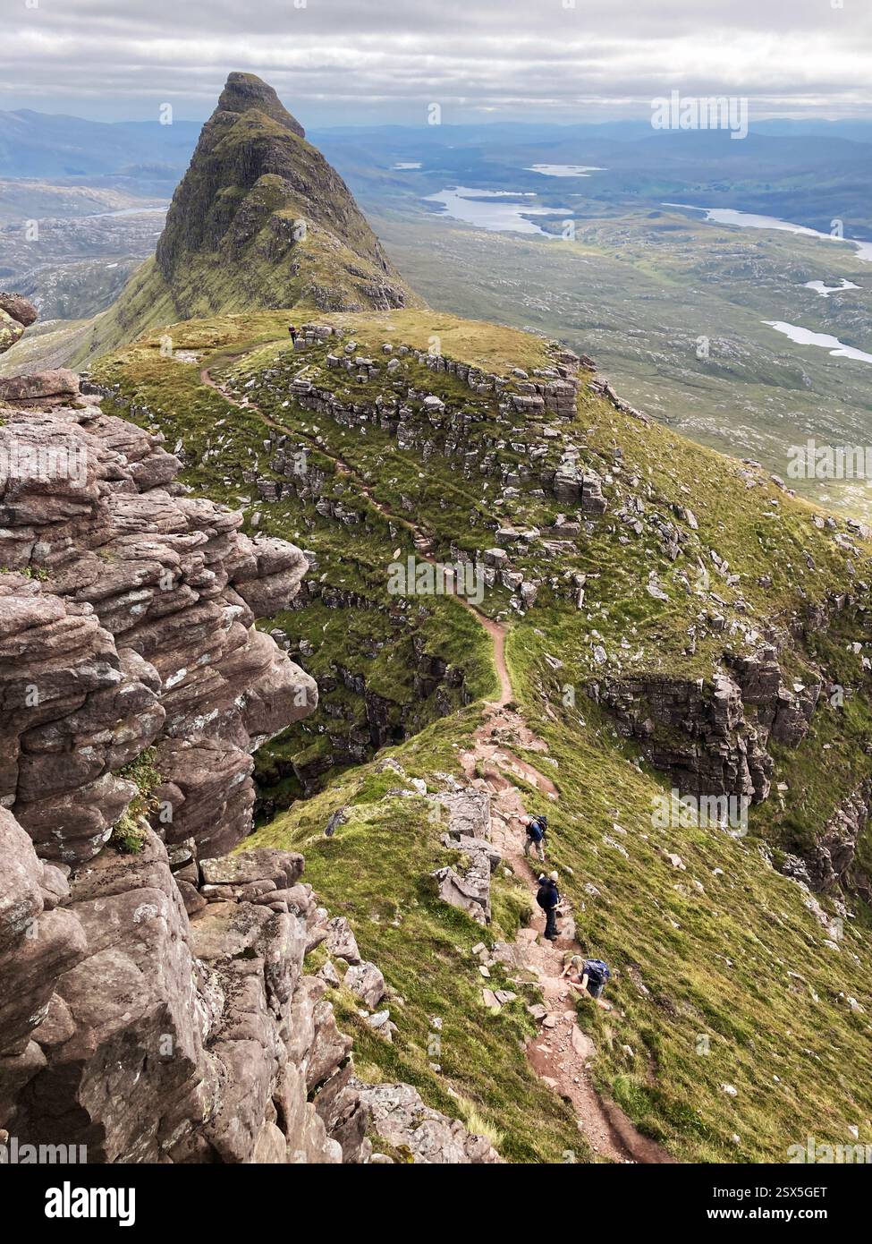 Hikers on the iconic Scottish mountain Suilven looking east, Inverpolly Sutherland, Scotland - Smartphone Captured Stock Image