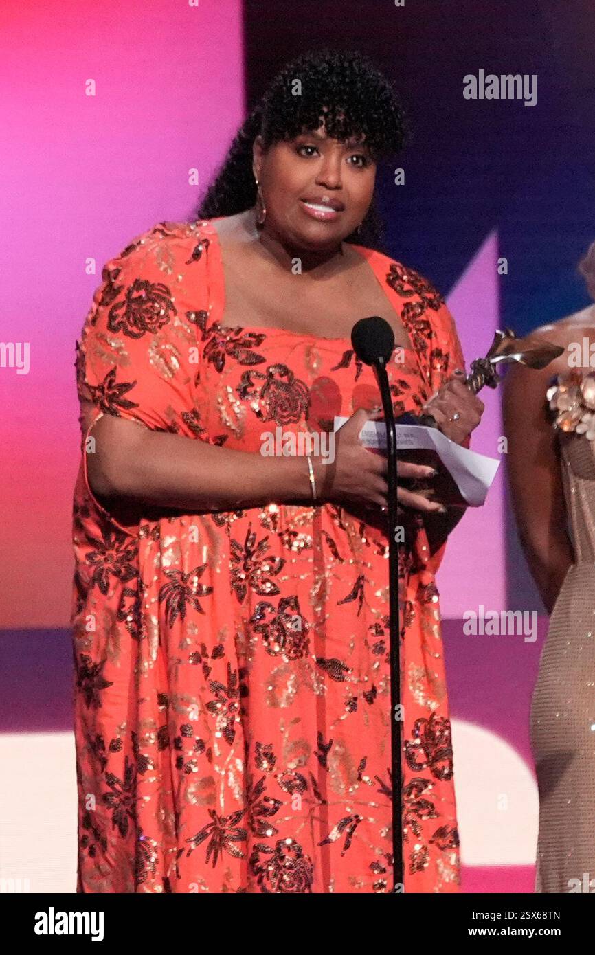 Natasha Rothwell accepts the award for best ensemble cast in a new ...