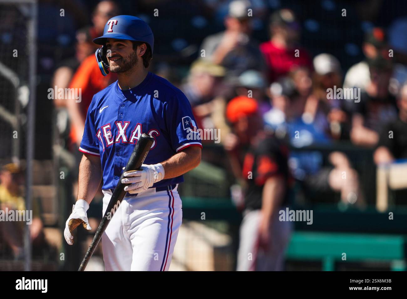Texas Rangers' Josh Smith walks back to the dugout after challenging a ...